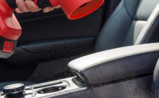 Blower aimed at a car center console.